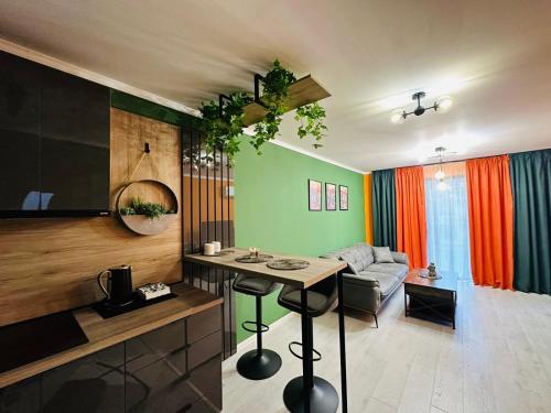 a living room with a table and a couch at Shtastliveca Guest Apartment in Velingrad
