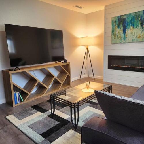 a living room with a tv and a couch at Spacious House in Federay Way, WA - Close to everything! in Federal Way