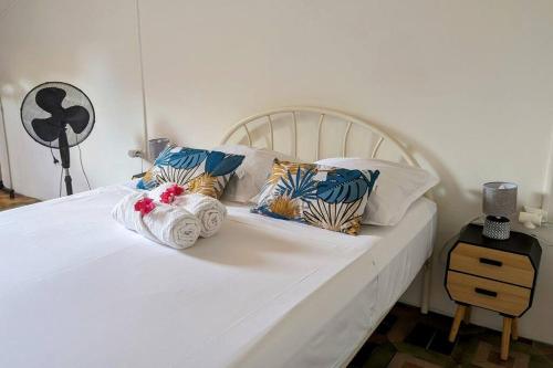 En eller flere senge i et værelse på Appartement Tropical Garden