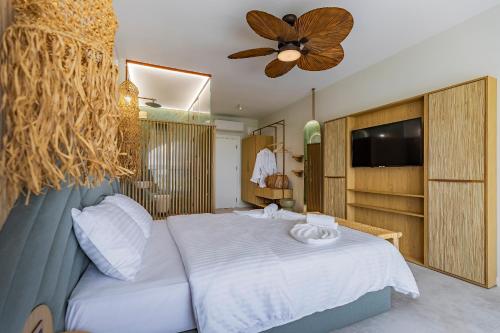 a bedroom with a bed and a ceiling fan at Casa Deniso - The Home of Chill in Byala