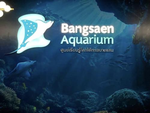 a aquarium with a white butterfly in the water at Cosy SeaView, High Floor, free Netflix in Bangsaen