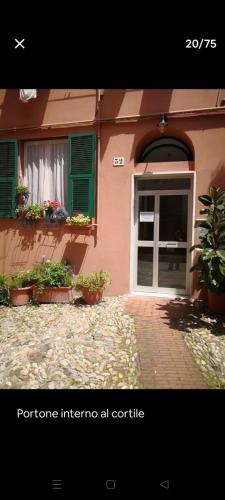 a house with a door and plants in front of it at Casa Matilde in Genova