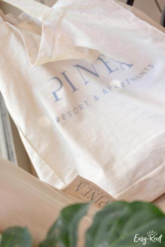 a white bag with the word pharmacy written on it at Apartamenty Pinea z widokiem na morze Easy - Rent Apartments in Pobierowo