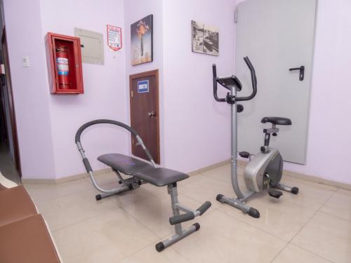 a gym with two exercise bikes in a room at Hotel El Ejido in Quito