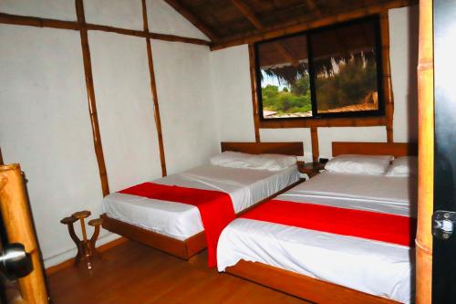 Katil atau katil-katil dalam bilik di Eco Hotel Campestre Atlantis San Joaquín La Mesa