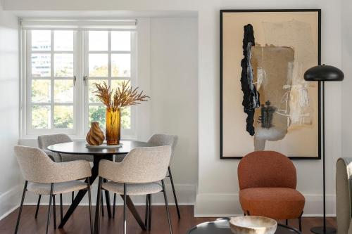 a dining room with a table and chairs at Bondi Junction Apartments by Urban Rest in Sydney