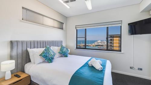 Postel nebo postele na pokoji v ubytování Darwin Waterfront Short Stay Apartments