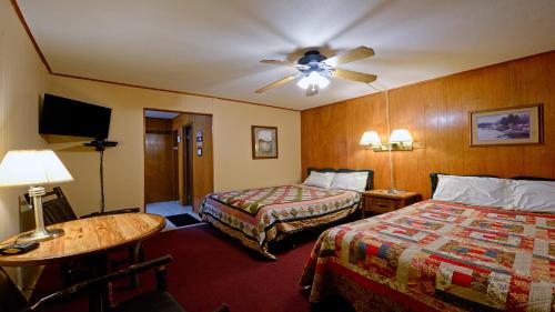 En eller flere senge i et værelse på Arrowhead 07 Deluxe