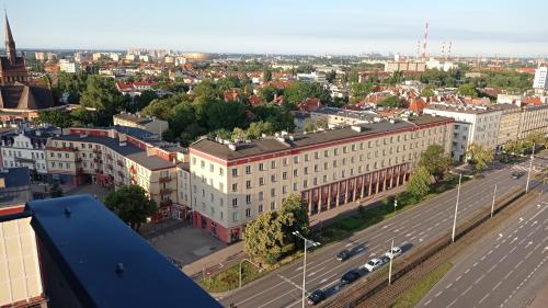an aerial view of a city with buildings and a street at Kawalerka Gdańsk Wrzeszcz in Gdańsk