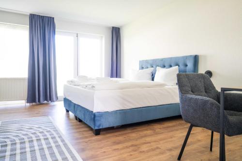 Ένα ή περισσότερα κρεβάτια σε δωμάτιο στο Johouse Zingst Johouse Zimmer 20