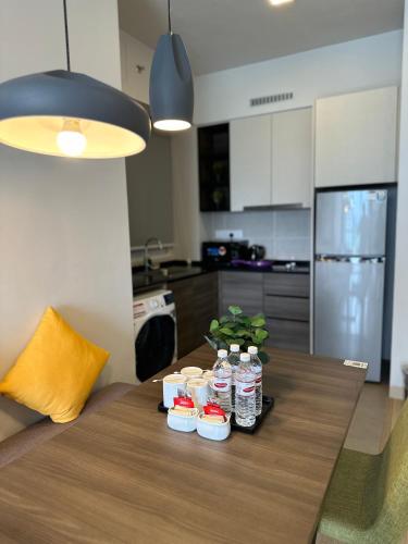 a table with bottles of water on it in a kitchen at Genting Windmill Homestay in Genting Highlands
