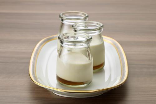 three glasses of milk on a plate on a table at Tokushima Grandvrio Hotel in Tokushima