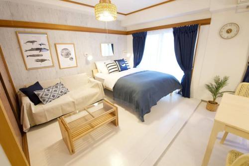 Ένα ή περισσότερα κρεβάτια σε δωμάτιο στο ATAMI Ocean Suite 碧 Ao 301