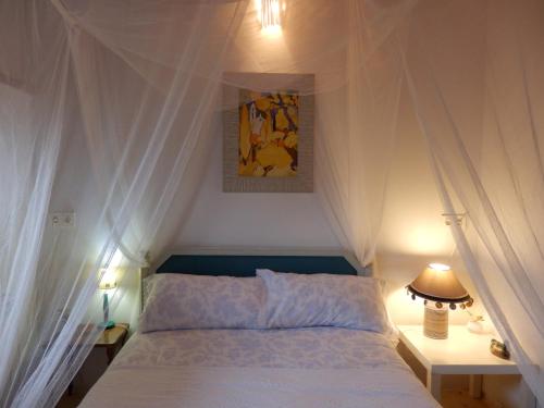 מיטה או מיטות בחדר ב-Casa Candana