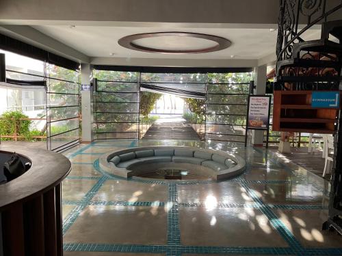 a room with a fountain in the middle of a building at Beach Bliss in Trincomalee