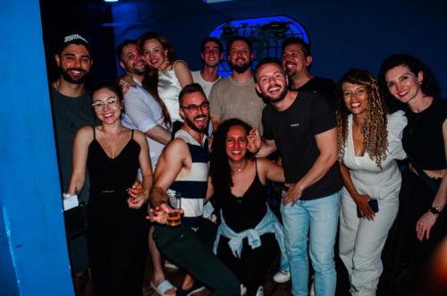 a group of people posing for a picture at a party at Kasa Hostel Karaokê in Balneário Camboriú