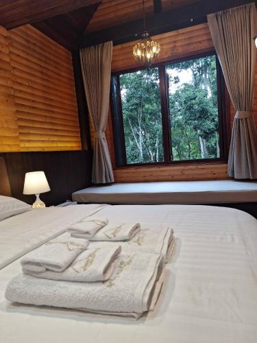 Katil atau katil-katil dalam bilik di บ้านคุณอัง Baan Khun Ang