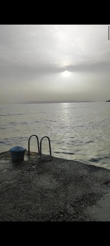 a view of a body of water with two metal bars at Amazing View in Drasnice