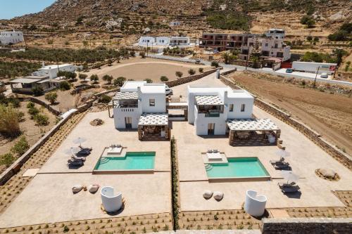 an aerial view of a resort with two swimming pools at Thalelion 3 bedroom Villas with private pool and Jacuzzi in Naxos Chora