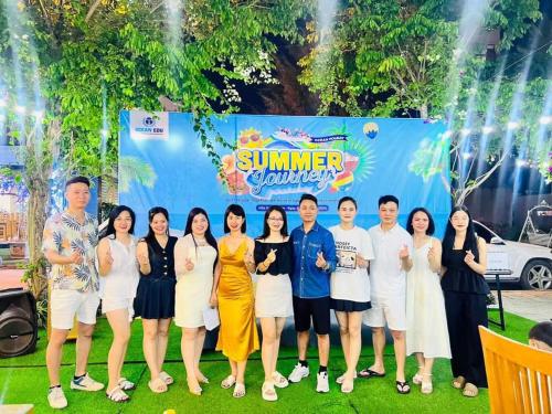 a group of people posing for a picture at a event at Melanta Hotel - FLC Sầm Sơn in Sầm Sơn