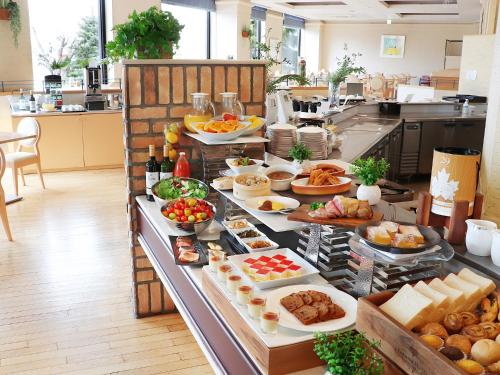 a buffet line with many different types of food at Premier Hotel -Tsubaki- Sapporo in Sapporo