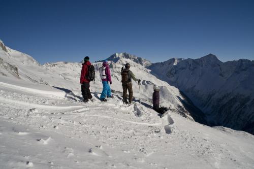 a group of people standing on top of a snow covered mountain at Ferienhotel Alber in Mallnitz