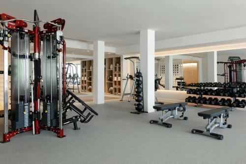 a gym with several treadmills and machines at Hotel Indigo Grand Cayman by IHG in Grand Cayman
