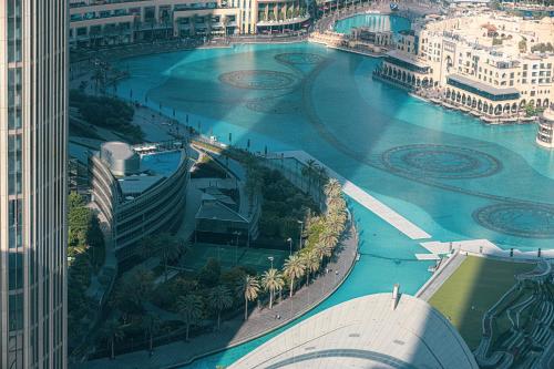 an aerial view of a river in a city at Luxury 4BR Burj Khalifa & Fountain Views in Dubai