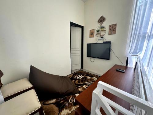 TV a/nebo společenská místnost v ubytování Villa Awwa