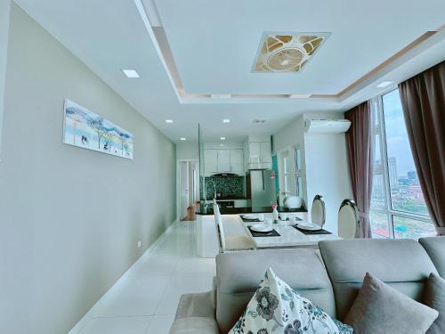 a living room with a couch and a table at Infinity 28 Hotel and Residence in Phnom Penh