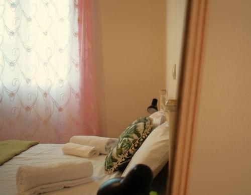 a reflection of a bedroom with a bed in a mirror at Calma House in Kanálion