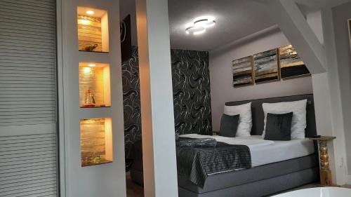a small bedroom with a bed in a room at Suite Stuermer in Nordhausen