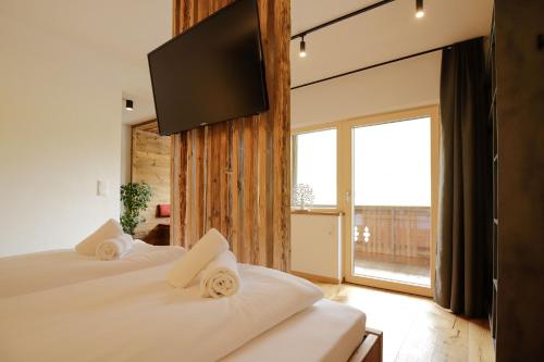 Postel nebo postele na pokoji v ubytování WOLF Apartments Padaun