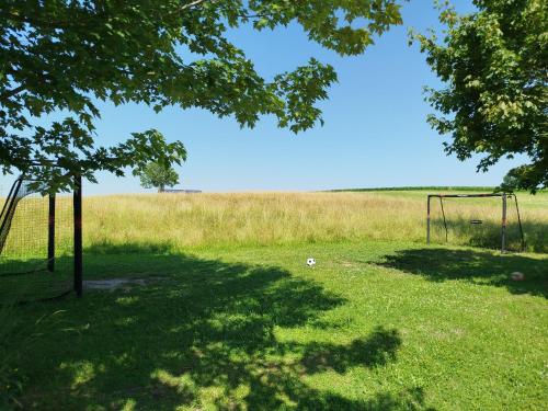 a field with a soccer goal in the grass at Familienhotel nahe der Therme Erding in Erding