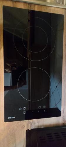 a microwave oven with its door open with a spiral at Гостевой дом 777 in Shchūchīnsk