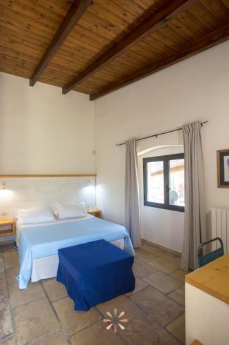 Postel nebo postele na pokoji v ubytování Agriturismo tenuta Margherita