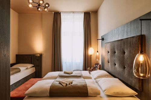 Ένα ή περισσότερα κρεβάτια σε δωμάτιο στο Urban Rooms Rathaus - Self Check-In