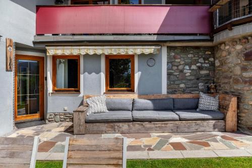 a couch sitting outside of a house at Haus Auner Top 5b in Westendorf