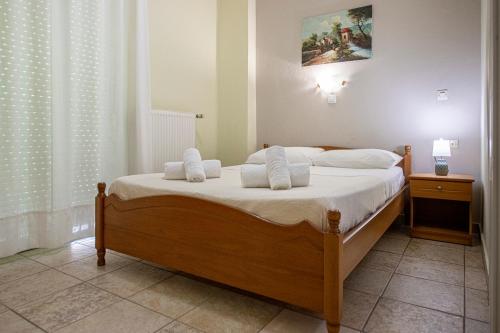 Postel nebo postele na pokoji v ubytování Lucia Hotel Paralia