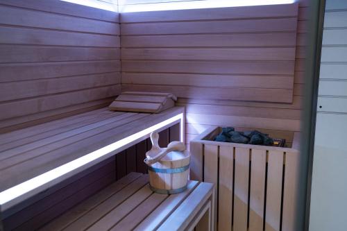 a sauna with a bench and a trash can at Palazzo Sangiorgio in Catania