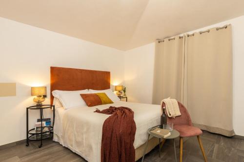 Postel nebo postele na pokoji v ubytování Loft Rooms I Cinque Mori