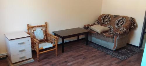 a room with a table and a chair and a table and a chair at Sevan Backstage Garden in Sevan