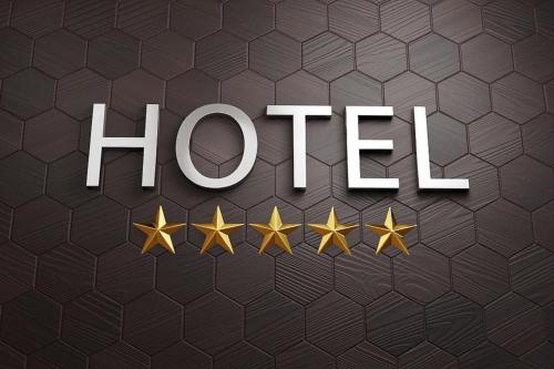 a group of gold stars with the word hirsch at Heimish Hotel in Tongyeong