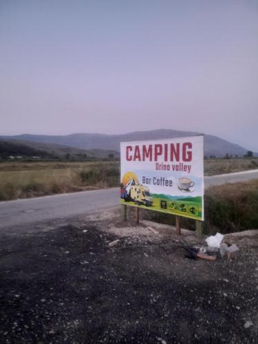 a campaigning sign on the side of a road at Camping DRINO VALLEY in Gjirokastër