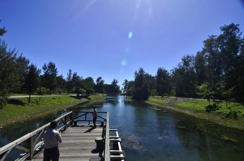 two people standing on a bridge over a river at Yiwa Homestay in Taitung City