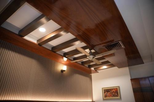 a ceiling in a room with a ceiling fan at The Ontime Hotel, Bangalore in Bengaluru