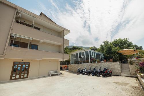 a group of motorcycles parked in front of a building at Voyage Villa in Vlorë