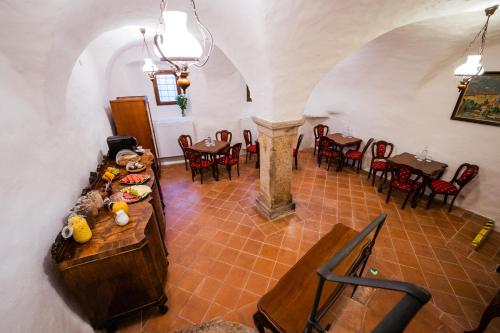 an overhead view of a dining room with tables and chairs at Penzion Baroko in Český Krumlov