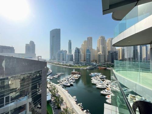 a view of a river with boats in a city at Dubai Marina Walk Gem Modern Apartments with Pool & Gym access, Steps to Beach & Metro Managed by SunnyHomes in Dubai