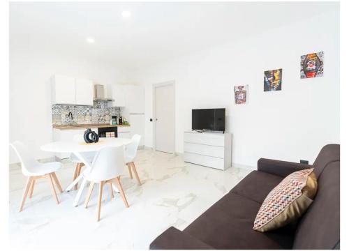 a living room with a couch and a table at B&B LuxHome in Catanzaro